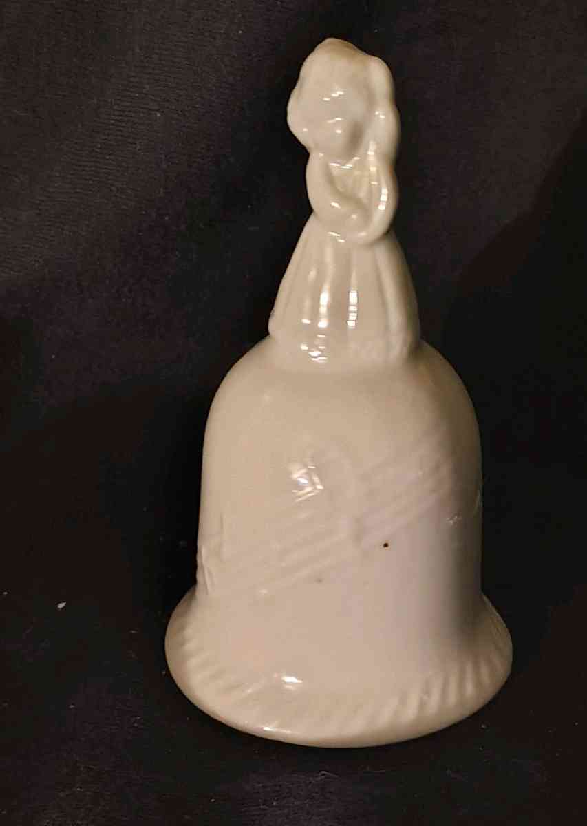 Girl standing on top of Bell - Austin, Minnesota