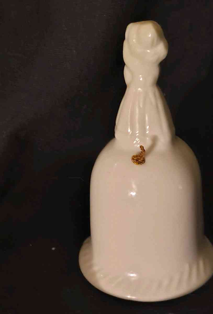 Girl standing on top of Bell - Austin, Minnesota - FleaMarketBay