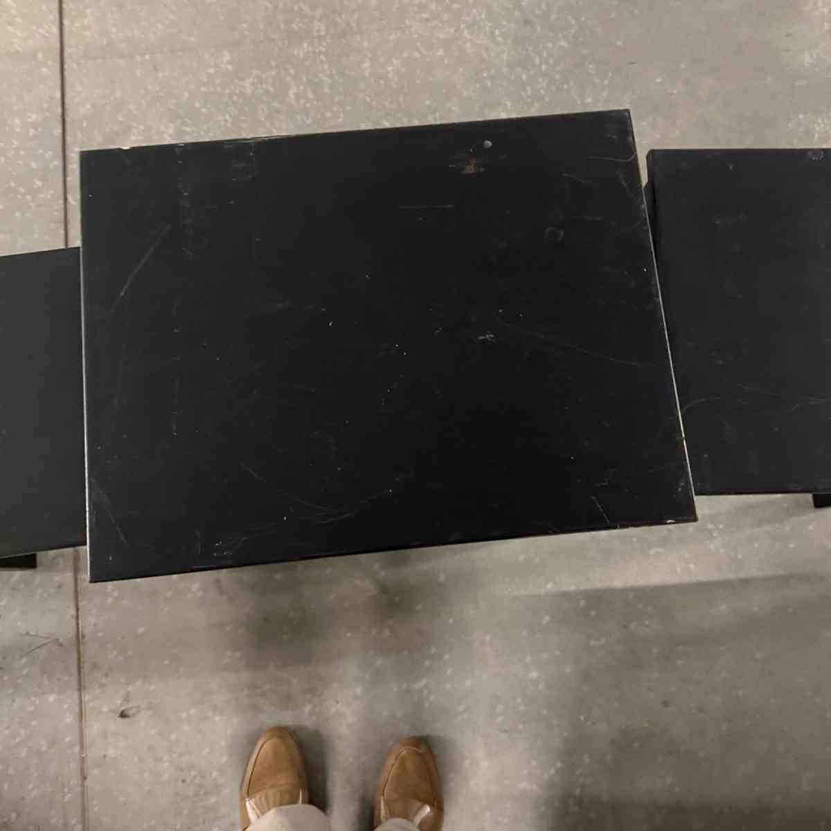 3 black tables slide under the other for easy storing used