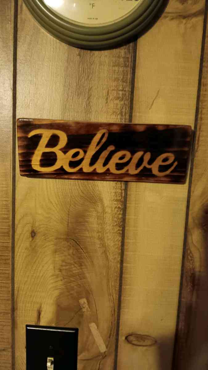 torched Believe sign - Bucksport, Maine