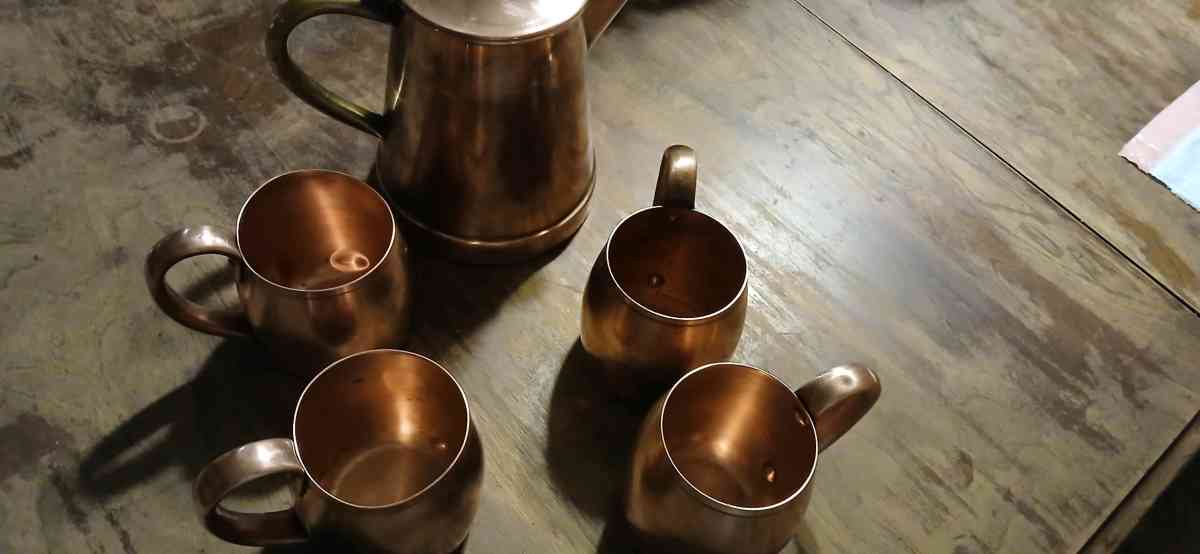 solid copper cups and a coffee pot - Jacksonville, Arkansas - FleaMarketBay