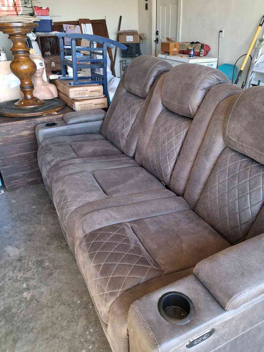 Brown suede couch the middle saint has a not lot in the midd