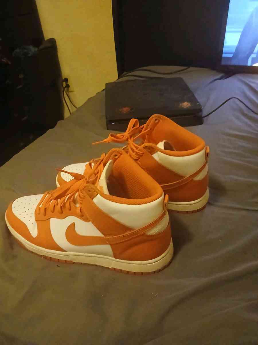 orange and white  Nike  shoes - Clover, South Carolina
