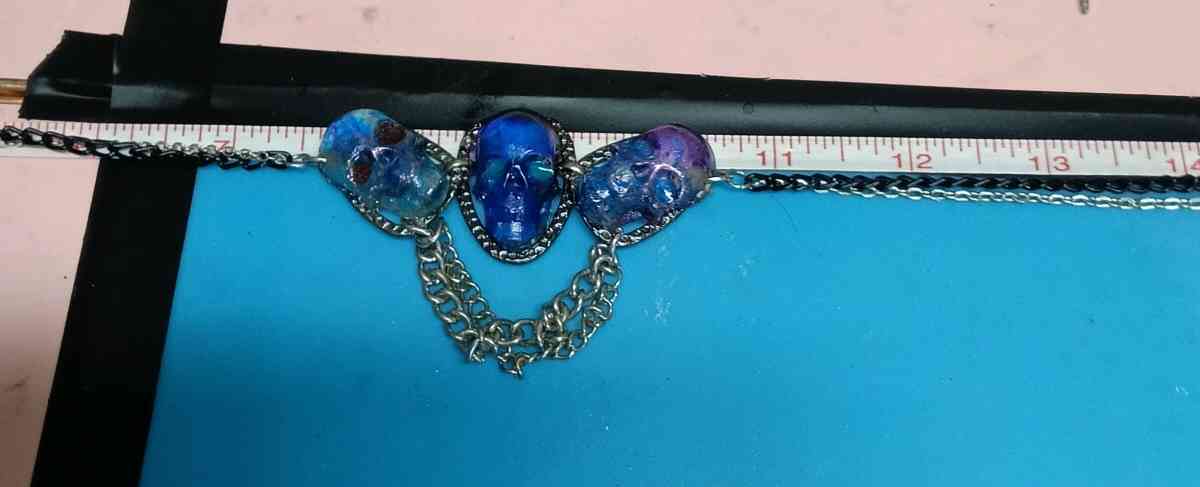 three skulls with multiple chains made with Uv resin - Lufkin, Texas - FleaMarketBay