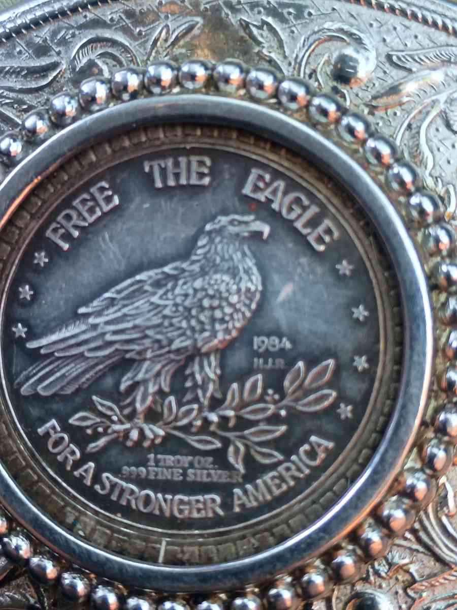 belt buckle with silver coin in the middle