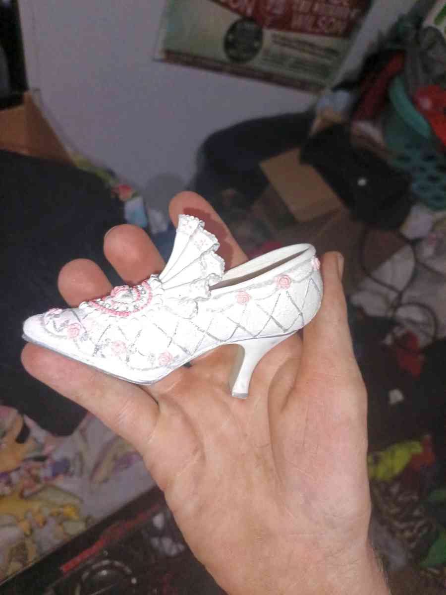 The product is a 35 ceramic Victorian floral shoe collectibl - Alicia, Arkansas