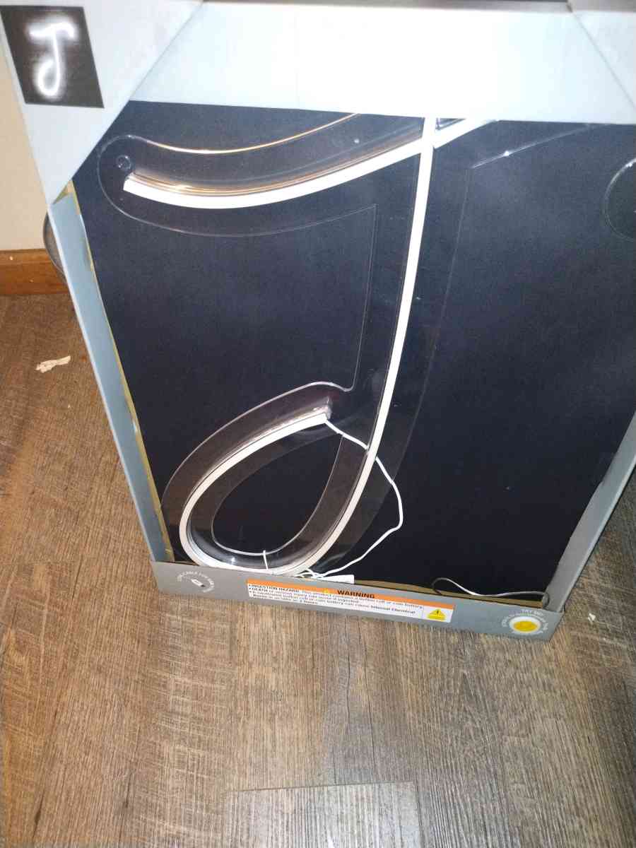 a neon light up j sign  brand new