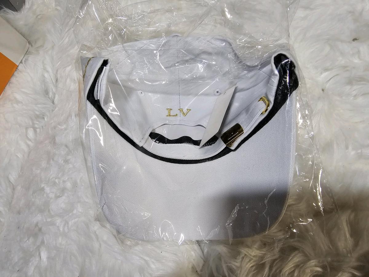 WHITE N GOLD LOUIS VUTTON LOGO HAT - Alicia, Arkansas - FleaMarketBay