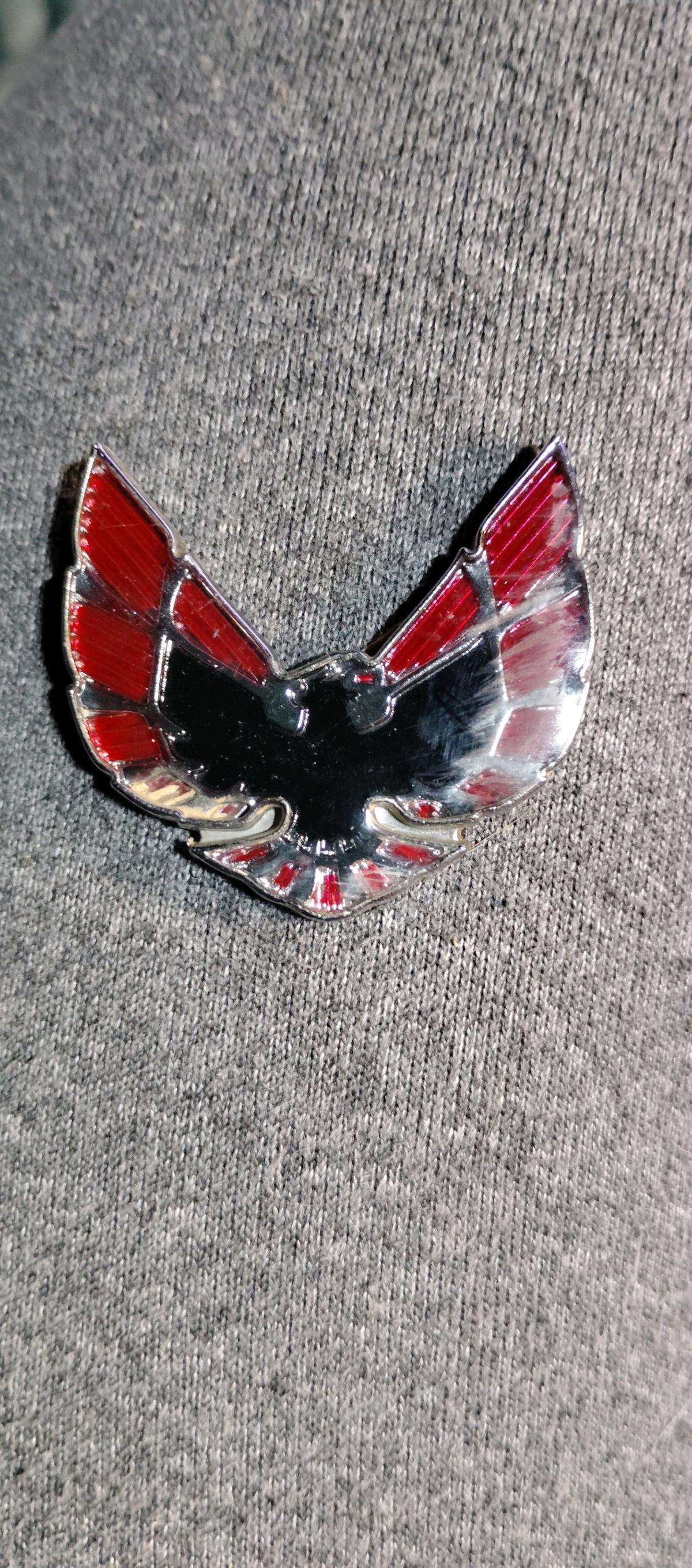 This item is a 19741976 Pontiac Firebird header panel emblem