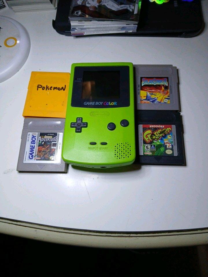 original green color gameboy with 4 games