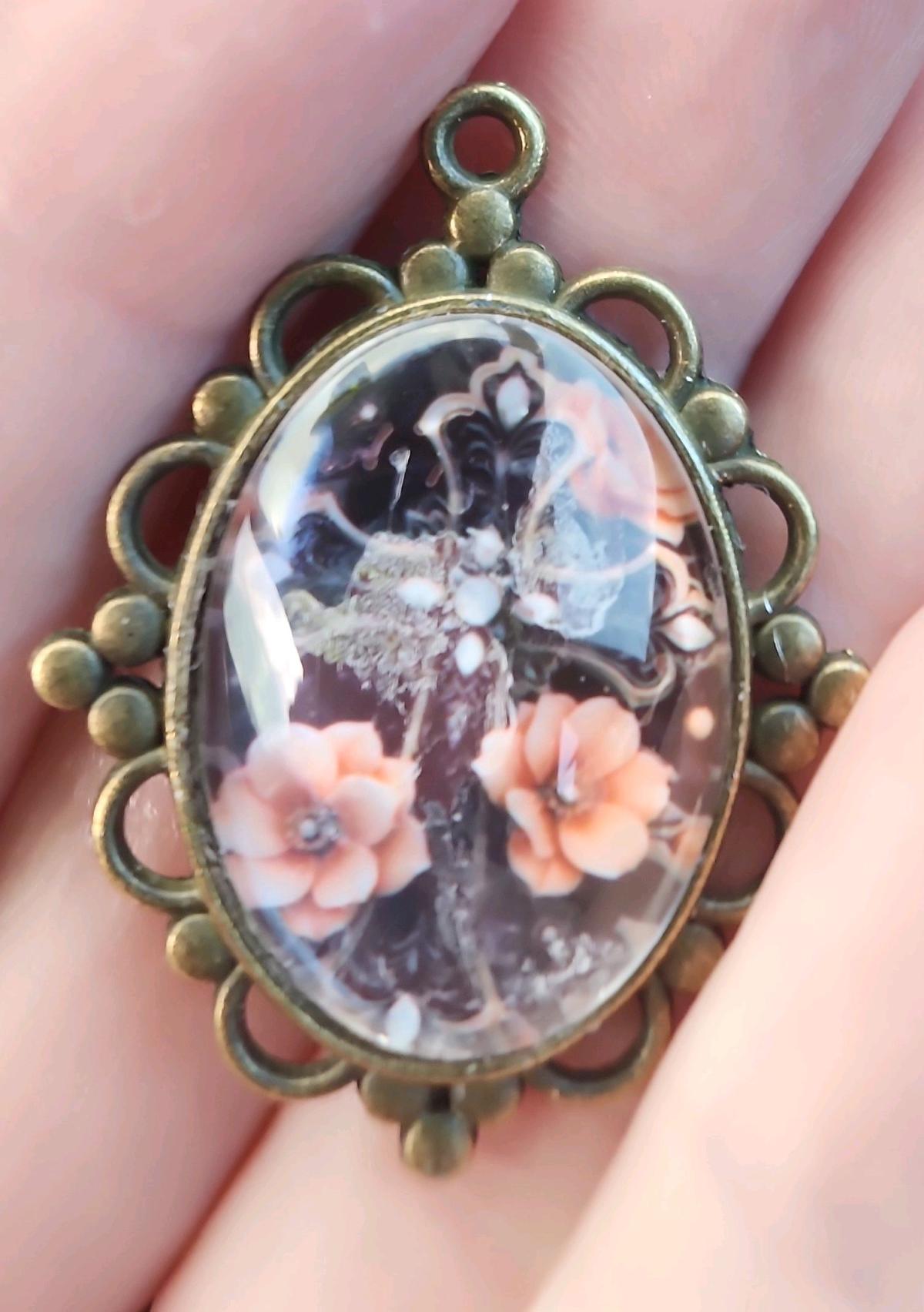 haunted cross picture in a pendant - Romney, West Virginia - FleaMarketBay