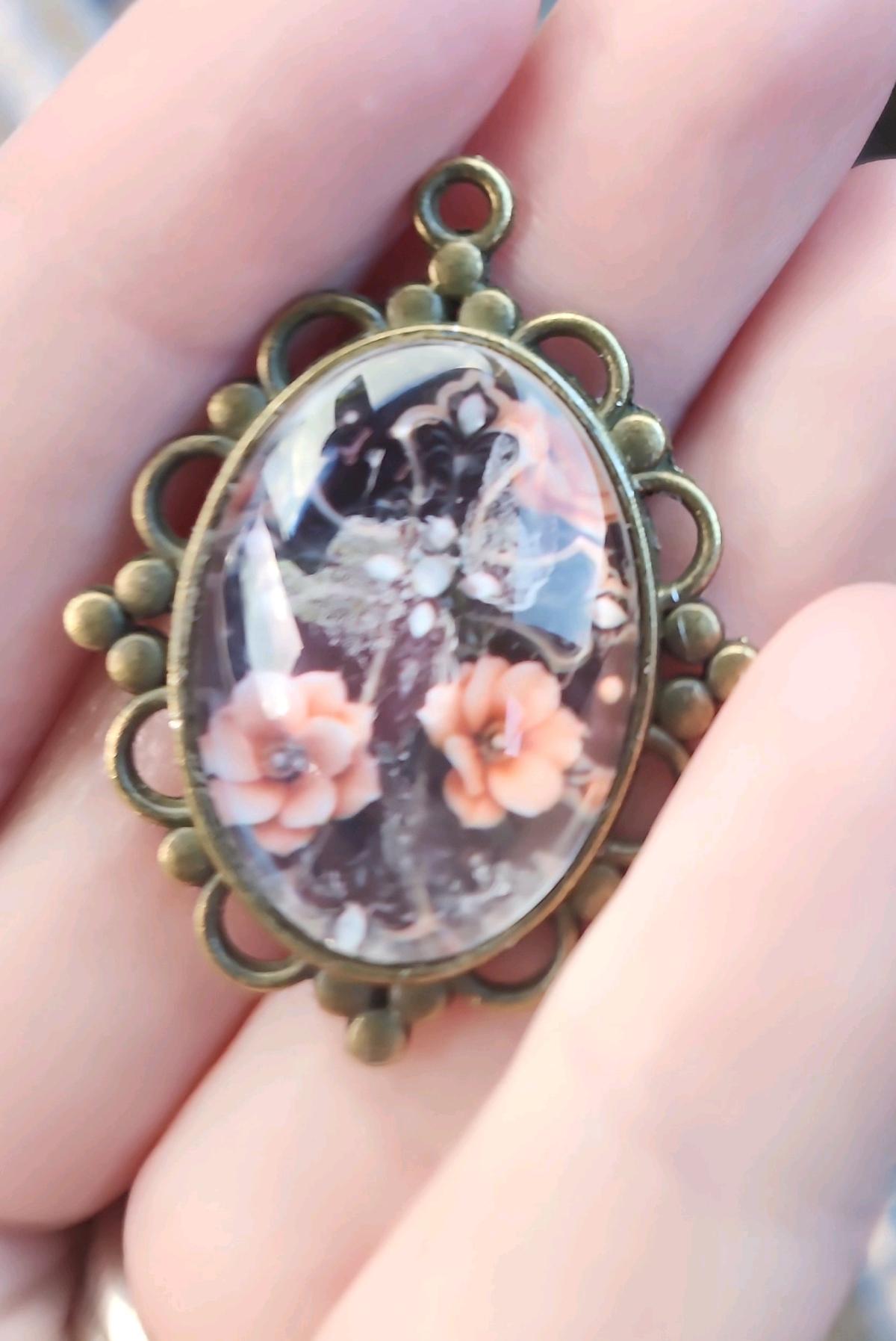 haunted cross picture in a pendant - Romney, West Virginia - FleaMarketBay